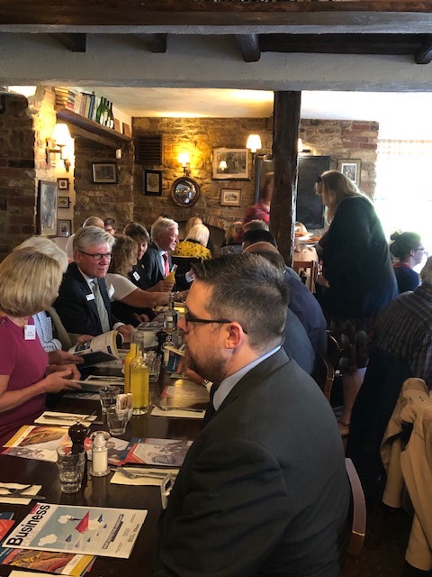 members chatting at tables