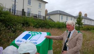 Dorchester Town Mayor, Robin Potter, unveiling the Nature Board. Damers Meadow Nature Information Board unveiled to help inform and educate.